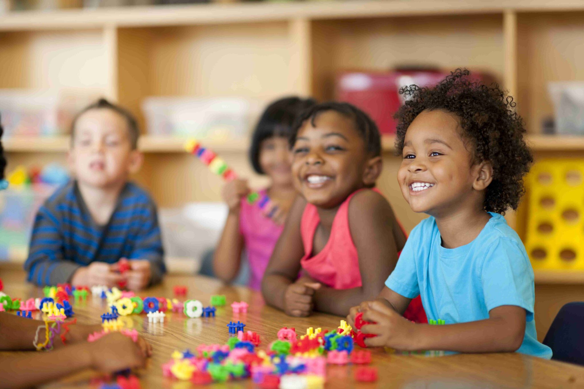 Teacher with diverse group of preschool children