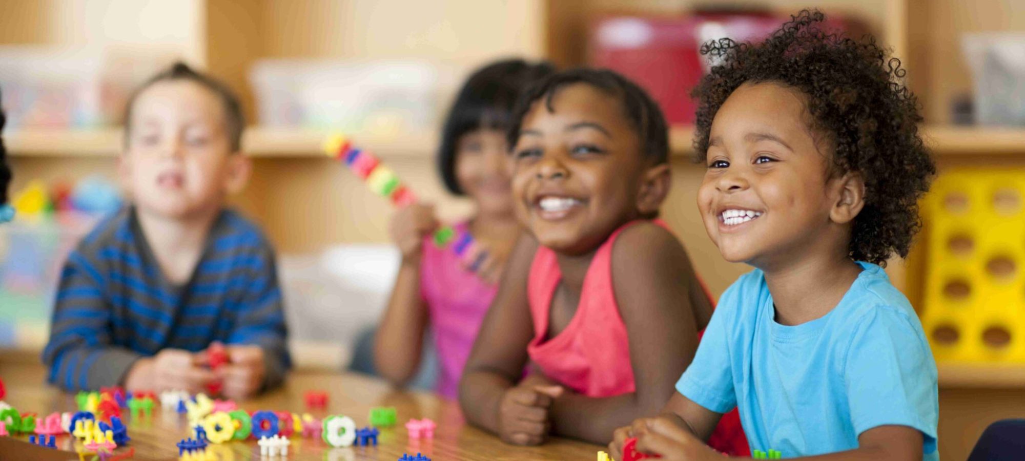 Teacher with diverse group of preschool children